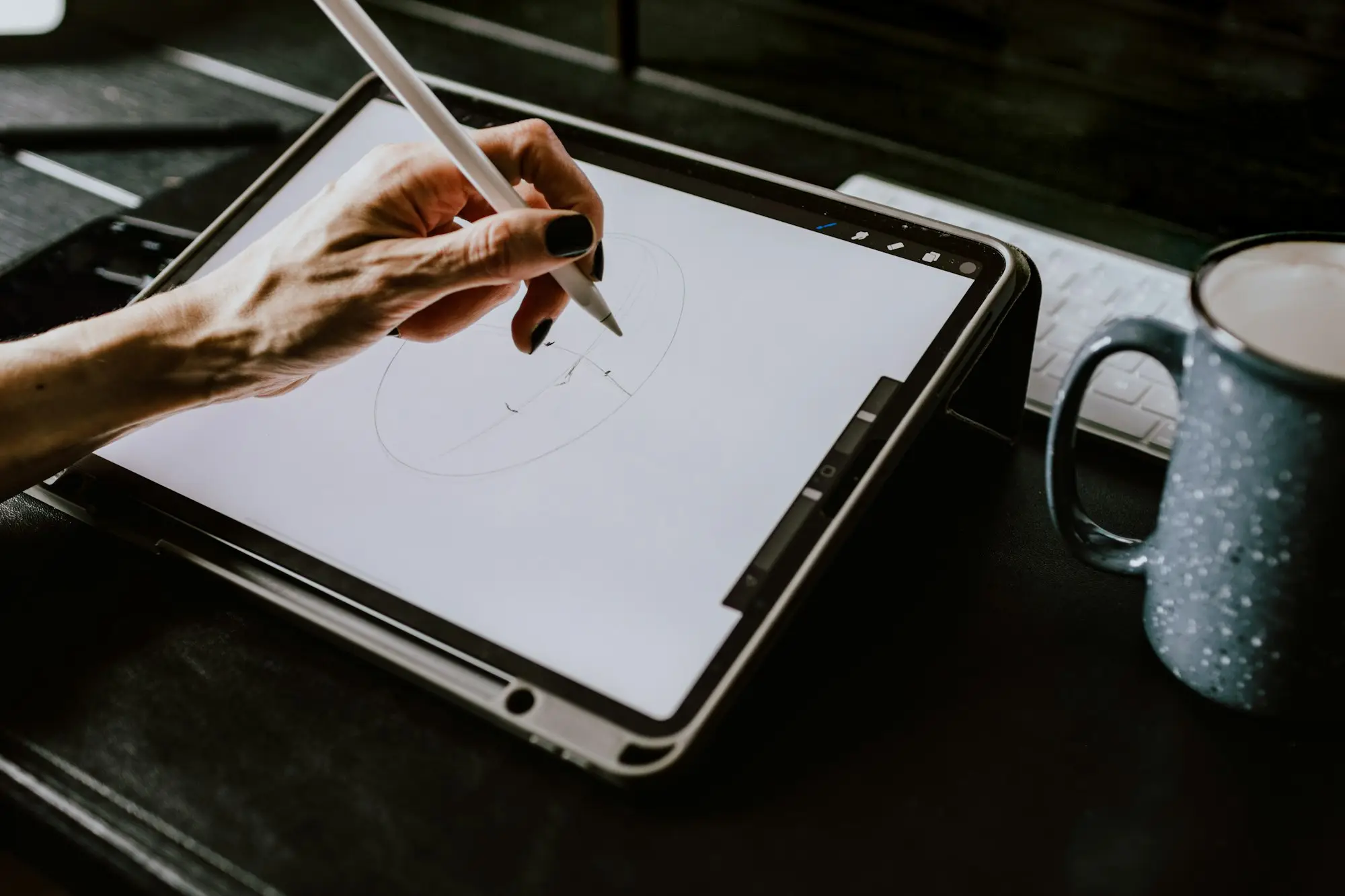 Hand signing on a tablet with a stylus, e-signing loan documents online