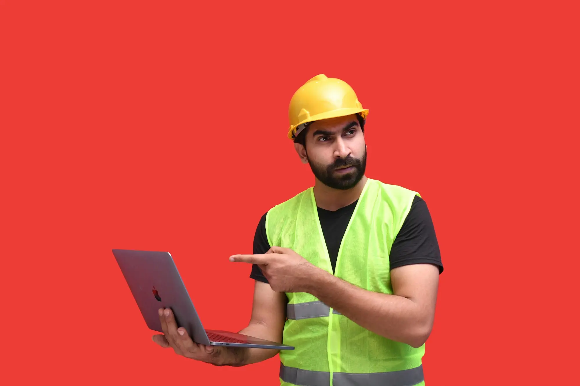 Tradie in a hard hat and hi-vis vest holding a laptop, ready to apply for a business loan online